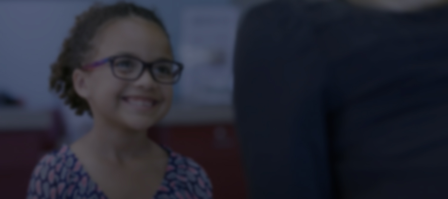 Blurred photo of child smiling at Credit Union in Windsor