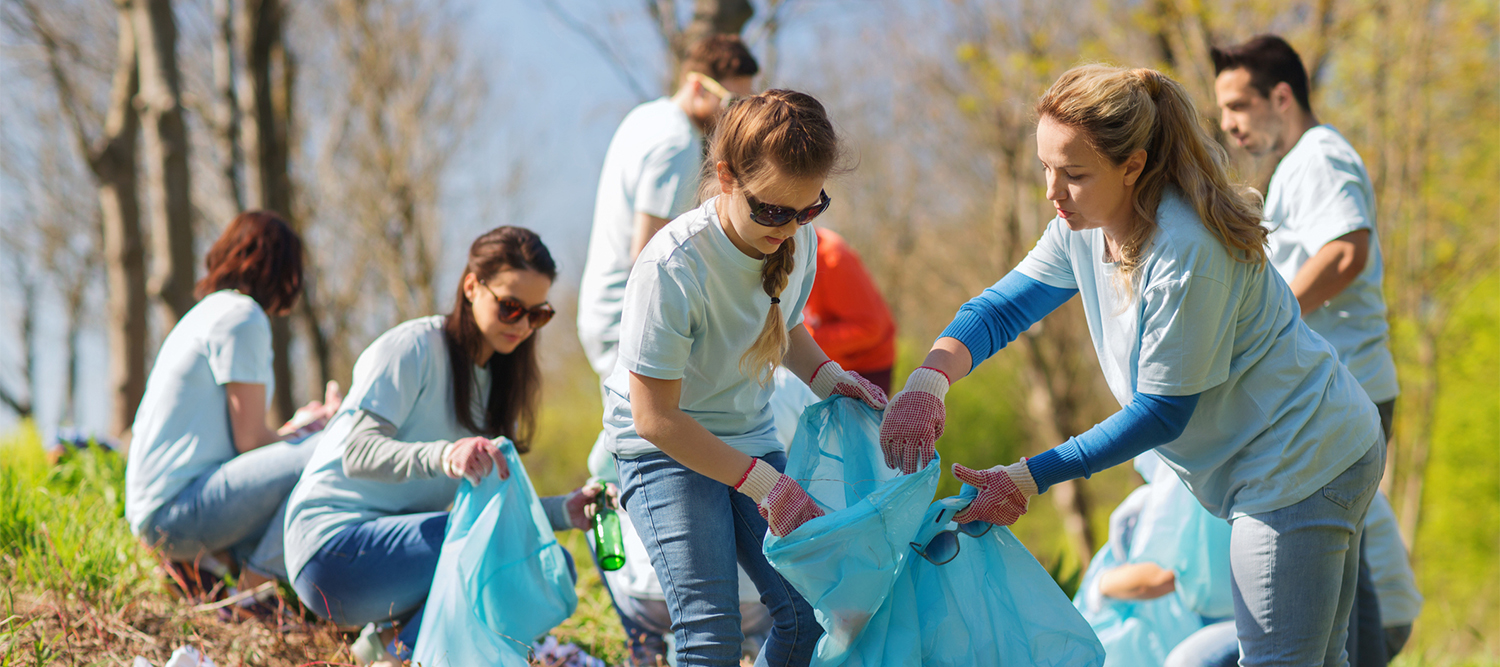 Community members cleaning garbage on Earth Day