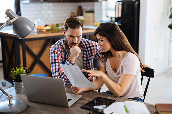 Couple reviewing their finances at home