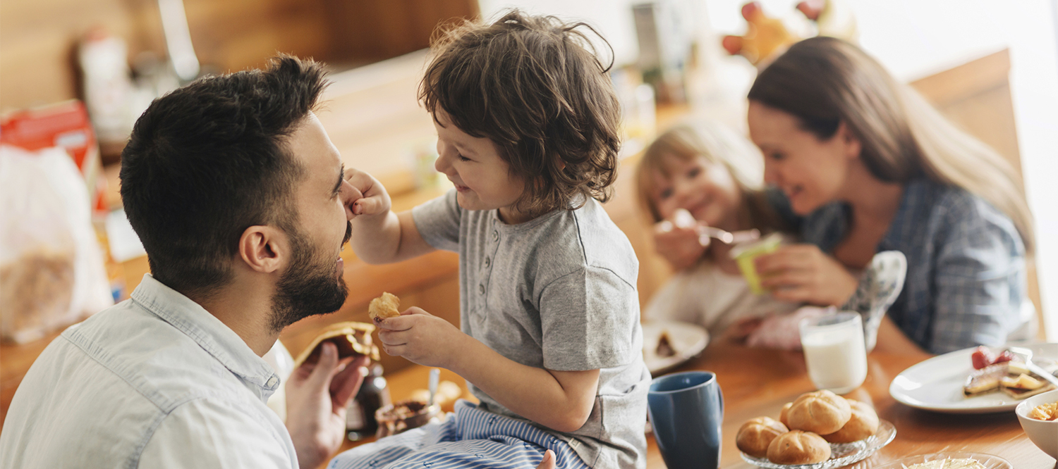 Family enjoying breakfast together