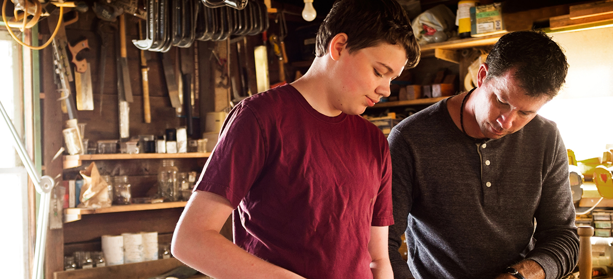 Father and Son Working in the Garage