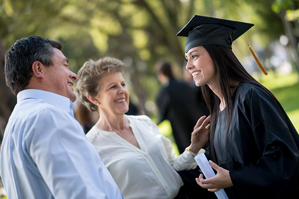 Grandparents congratulating granddaughter after Graduation