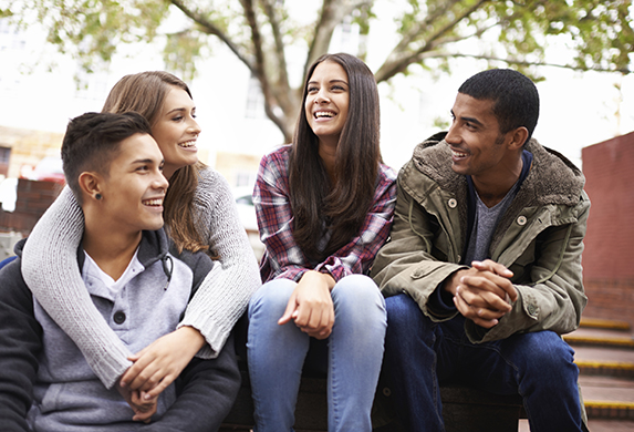 Happy college friends during autumn