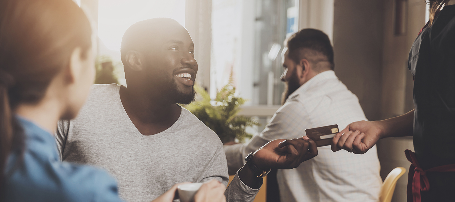 Man paying for lunch with Collabria CreditCard