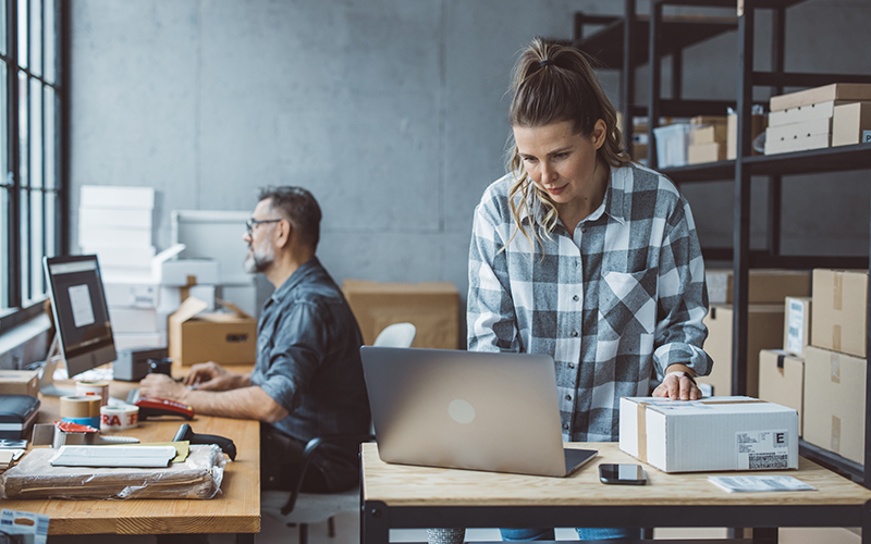 Small business owners working in their shop