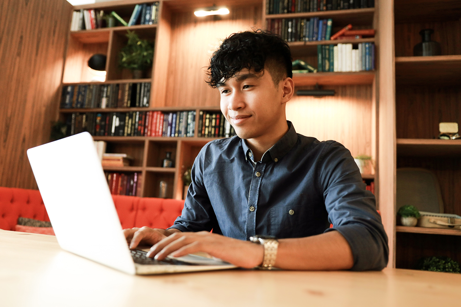 Student working on laptop in the library