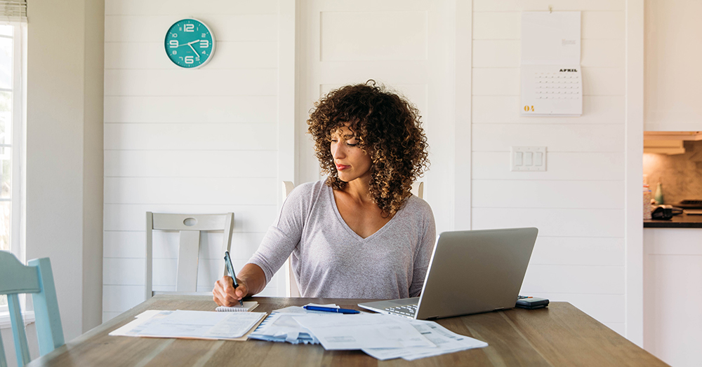 Woman working on finances at home